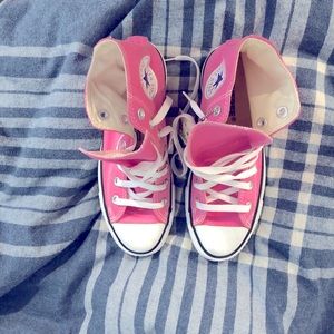 Bubble gum pink Converse high tops.